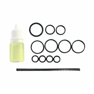 Tippmann Gryphon Gas Line O-Ring - small lubricant bottle beside O-rings and long coil spring