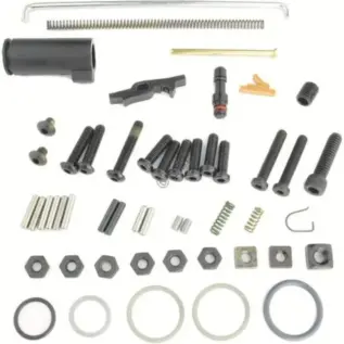 Tippmann 98 Universal Parts Kit - assorted screws springs O-rings pins and spare parts laid out on white